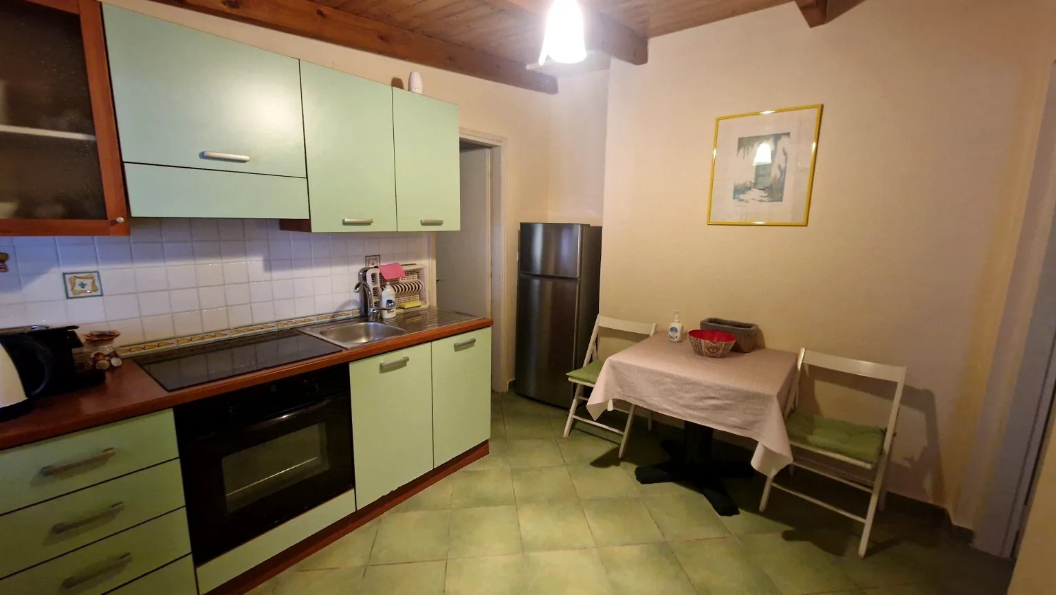 Fully equipped kitchen and dining area at Il Prato, Villa Vanda