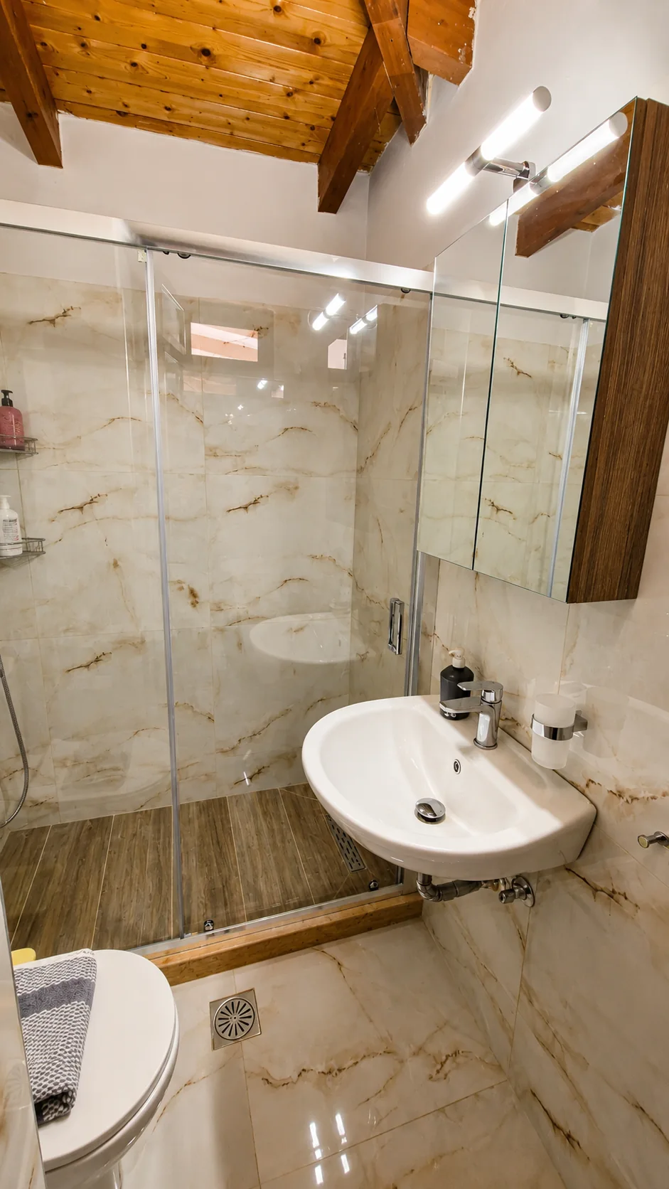 Bathroom with glass shower enclosure at La Terrazza, Villa Vanda
